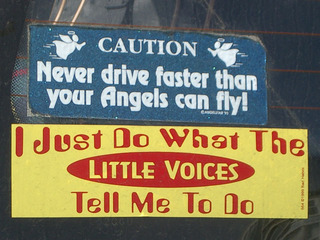 [Two car stickers: 'Never drive faster than your angels can fly' and 'I just do what the little voices tell me to']