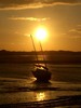 [Sunset over a boat on the River Esk near Ravenglass]
